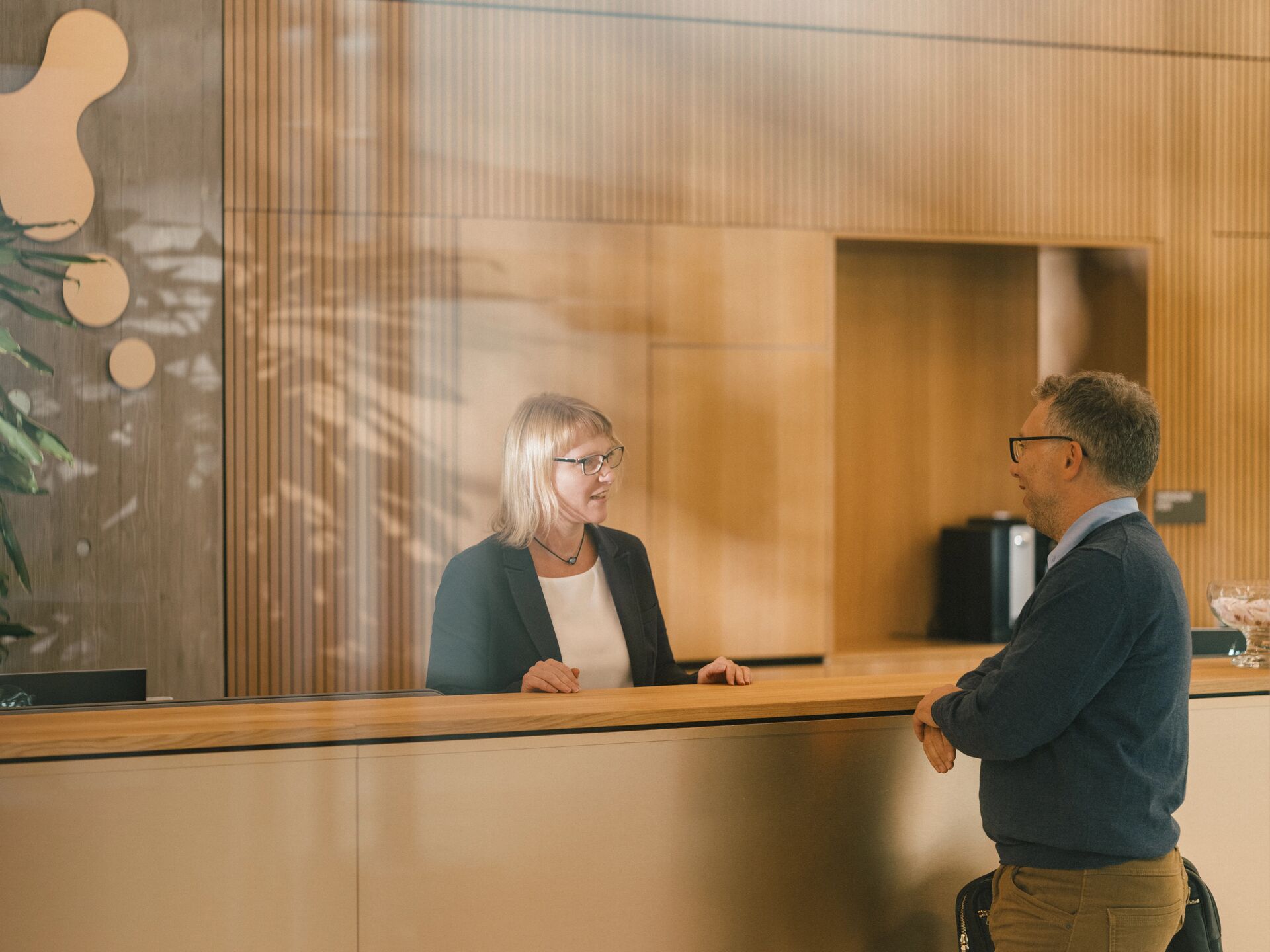 Client speaking with receptionist